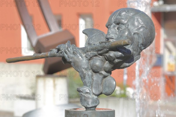 Sculpture Flute Player by Karel Fron 2008, bronze sculpture, modern art, bizarre head with flute, torso, Brunnengalerie, Adenauerplatz, Wiesloch, Baden-Württemberg, Germany