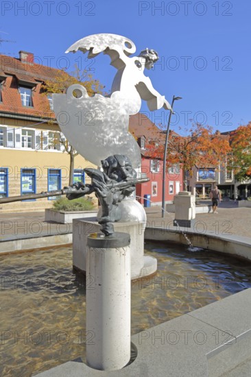 Sculpture guardian angel Angel by Jürgen Goertz and Flute Player by Karel Fron, 2008, modern art, water basin, fountain, shiny angel with index finger, silver, aluminium, bizarre head with flute, torso, bronze sculpture, water basin, fountain gallery, Adenauerplatz, Wiesloch, Baden-Württemberg, Germany
