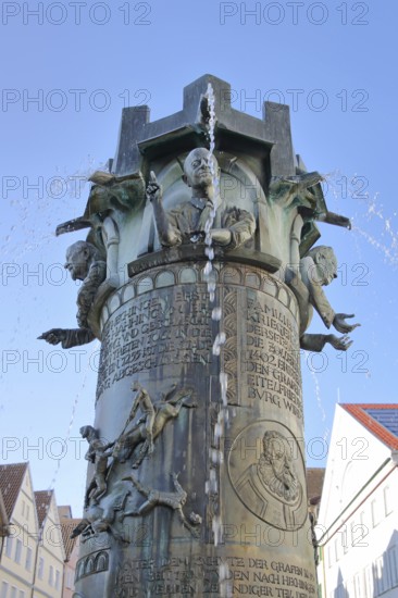 Town hall fountain by Klaus Ringwald 1998, bronze sculptures, reliefs, figures and text on the history of the town, inscription, water features, detail, market square, Hechingen, Swabian Alb, Baden-Württemberg, Germany