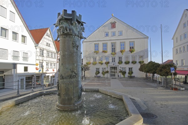 Town hall built in 1958 and town hall fountain with reliefs and figures by Klaus Ringwald 1998, market square, Hechingen, Swabian Alb, Baden-Württemberg, Germany