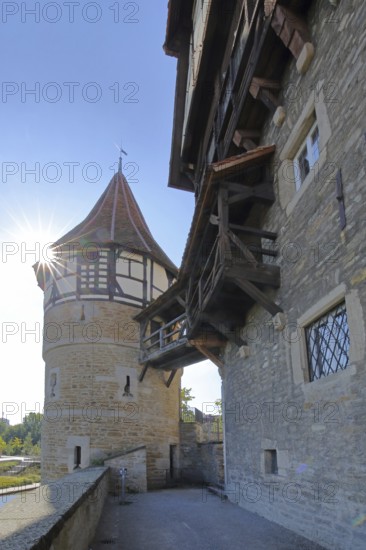 Water tower with outside staircase built around 1255 in backlight, wooden bridge, Zollernschloss, castle, Balingen, Swabian Alb, Baden-Württemberg, Germany
