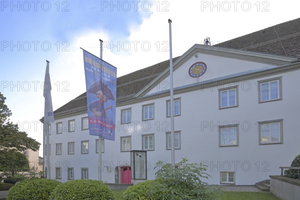 Old Castle and Hohenzollern State Museum built in 1705, flags, banners, Hechingen, Swabian Alb, Baden-Württemberg, Germany