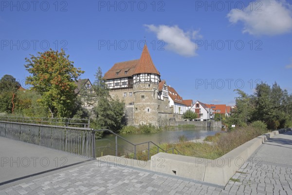Zollern Castle built around 1255 with water tower on the bridge over the Eybach stream, half-timbered house, autumn, castle, Balingen, Swabian Alb, Baden-Württemberg, Germany