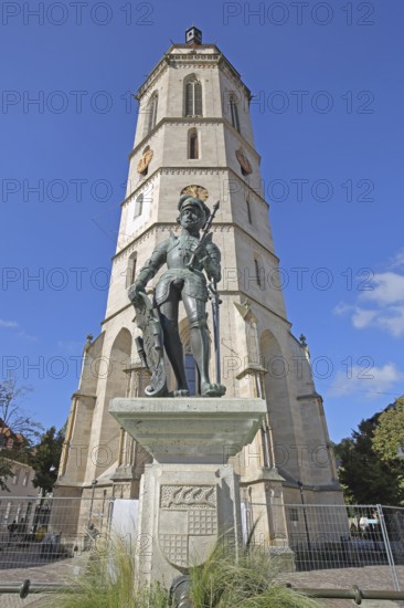Market fountain with medieval knight figure, Württemberg coat of arms shield with sword, bronze sculpture, knight's armour, landmark town church, market square, Balingen, Swabian Alb, Baden-Württemberg, Germany