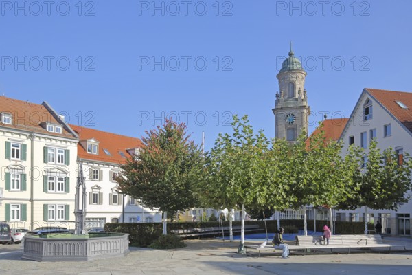 Obertorplatz with church tower of the collegiate church of St James, benches, people sitting, Hechingen, Swabian Alb, Baden-Württemberg, Germany
