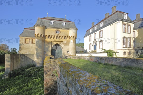 Portal with archway, large castle built in the 18th century, bridge, Kleinbüllesheim, Euskirchen, Vordereifel, Eifel, North Rhine-Westphalia, Germany