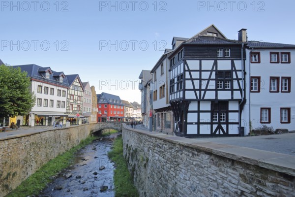 Erft stream with stone arch bridge and half-timbered houses, Delle, Bad Münstereifel, Ahrgebirge, Eifel, North Rhine-Westphalia, Germany
