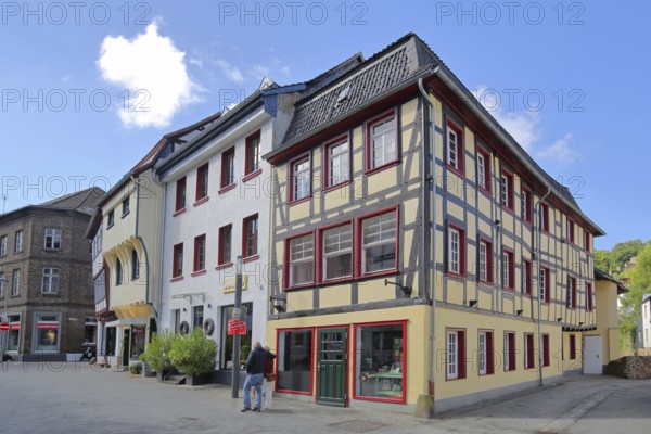 Half-timbered houses, pedestrians, Orchheimer Straße, Bad Münstereifel, Ahrgebirge, Eifel, North Rhine-Westphalia, Germany