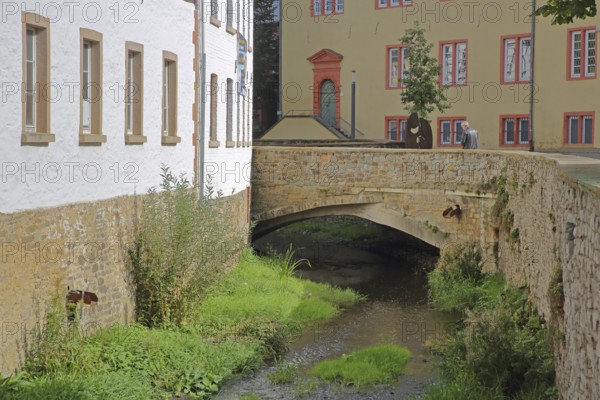 Brewery with stone arch bridge for the Erft and St Michael's Grammar School, market, Bad Münstereifel, Ahrgebirge, Eifel, North Rhine-Westphalia, Germany