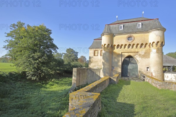 Portal with archway, large castle built in the 18th century, bridge, castle moat, Kleinbüllesheim, Euskirchen, Vordereifel, Eifel, North Rhine-Westphalia, Germany