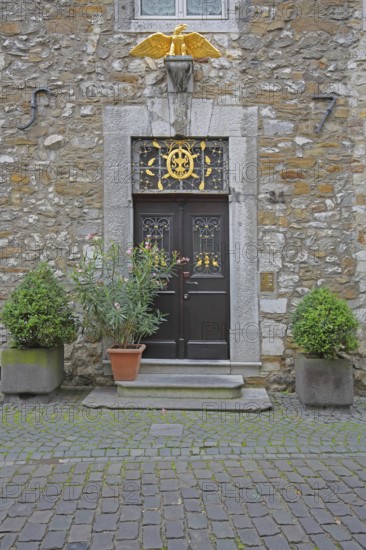 Front door with golden eagle figure to Kupferhof Schleicher, decoration, Burggasse, Rhineland, Stolberg, North Rhine-Westphalia, Germany