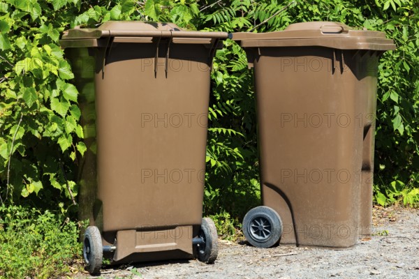 Brown plastic portable composting bins for depositing organic materials and leftover foods in, Quebec, Canada