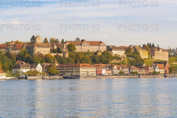 Historic buildings on the shore of a lake, surrounded by hills, Meersburg, Lake Constance, Germany