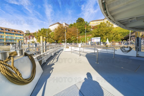 Open ship deck with a view of the shore landscape and autumn weather, Meersburg, Lake Constance, Germany