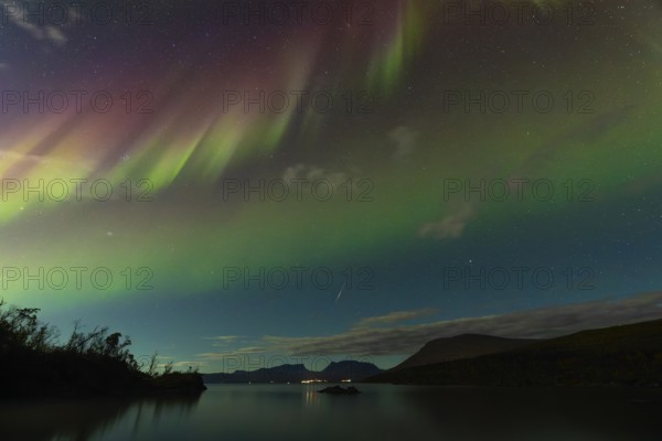 Magical northern lights and a shooting star over Abisko, Lapporten and Lake Torneträsk