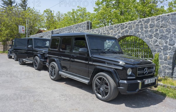 Two black Mercedes off-road vehicles parked next to each other in a car park, Mercedes-Benz G-Class, Mercedes AMG G 63, Aragazotn Province, Armenia