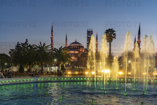 Fountain in Sultan Ahmet Park and the Blue Mosque or Sultan Ahmed Mosque at dusk, Istanbul, Turkey