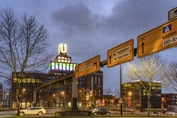 Traffic signs at Wallring and Dortmund's landmark U, Centre for Art and Creativity at dusk, Dortmund, North Rhine-Westphalia, Germany