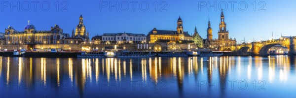Old town skyline with Brühl's Terraces, Kunstakdeimie, Church of Our Lady, Cathedral Sanctissimae Trinitatis, Court of Appeal, Augustus Bridge, paddle steamer on the Elbe in the blue hour, reflection, panorama, Dresden, Saxony, Germany