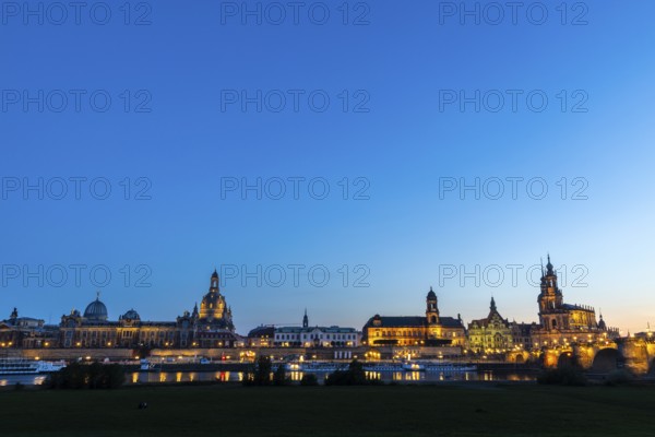 Old town skyline with Brühl's Terraces, Sanctissimae Trinitatis Cathedral, Court of Appeal, Royal Palace, Semper Opera House, Augustus Bridge, paddle steamer on the Elbe in the Blue Hour, Dresden, Saxony, Germany