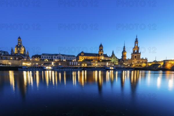 Old town skyline with Brühl's Terraces, Church of Our Lady, Cathedral Sanctissimae Trinitatis, Court of Appeal, Augustus Bridge, paddle steamer on the Elbe in the blue hour, reflection, Dresden, Saxony, Germany