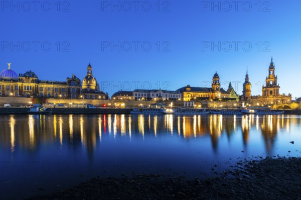 Old town skyline with Brühl's Terraces, Kunstakdeimie, Church of Our Lady, Cathedral Sanctissimae Trinitatis, Residenzschloss, Higher Regional Court, paddle steamer on the Elbe in the blue hour, reflection, Dresden, Saxony, Germany