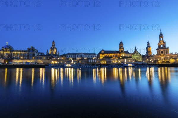 Old town skyline with Brühl's Terraces, Church of Our Lady, Academy of Fine Arts, Cathedral Sanctissimae Trinitatis, Court of Appeal, Augustus Bridge, paddle steamer on the Elbe in the blue hour, reflection, Dresden, Saxony, Germany
