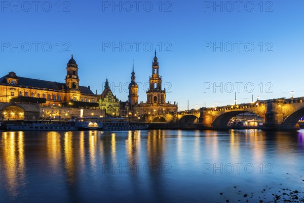 Old town skyline with Brühl's Terraces, Cathedral Sanctissimae Trinitatis, Court of Appeal, Augustus Bridge, paddle steamer on the Elbe in the Blue Hour, Dresden, Saxony, Germany