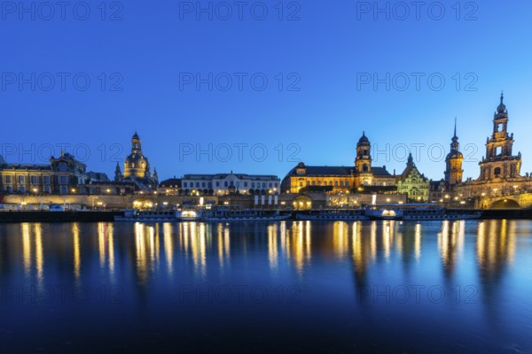 Old town skyline with Brühl's Terraces, Church of Our Lady, Academy of Fine Arts, Cathedral Sanctissimae Trinitatis, Higher Regional Court, paddle steamer on the Elbe in the blue hour, reflection, Dresden, Saxony, Germany