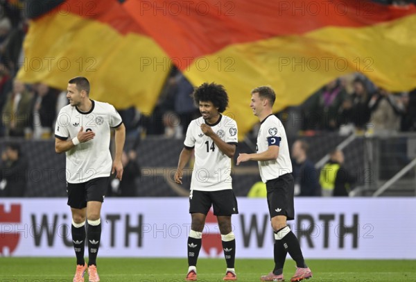 Goal celebration Joshua Kimmich GER (06) Karim Adeyemi GER (14) Waldemar Anton GER (02) National flag Flag Germany flag black-red-gold World Cup qualifier, international match, Germany v Luxembourg, PreZero Arena, Sinsheim, Baden-Württemberg, Germany