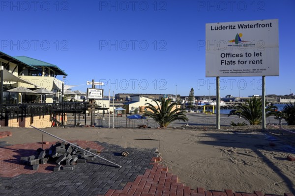 Sign at a building site on the waterfront, Robert Harbour, Lüderitz, Karas Region, Namibia