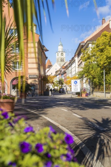 A lively street in a town with historic buildings and a church tower, Überlingen, Lake Constance, Germany