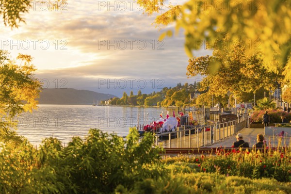 Picturesque lakeside promenade at sunset with a view over the tranquil lake, Überlingen, Lake Constance, Germany