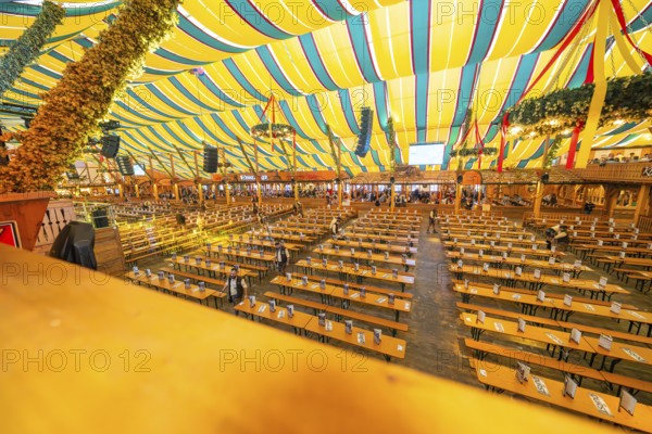 Large marquee with colourful stripes and traditional interior design, Cannstatter Wasen folk festival, Stuttgart, Germany