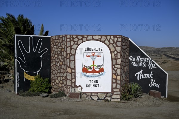 Sign at the entrance to the town, town coat of arms, Lüderitz, Karas region, Namibia