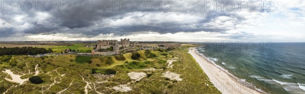 Panorama of Bamburgh Castle from a drone, Northumberland, Northeast Coast, England, United Kingdom