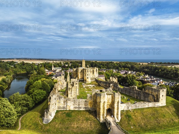 Warkworth Castle over River Coquet from a drone, Warkworth, Northumberland, England, United Kingdom