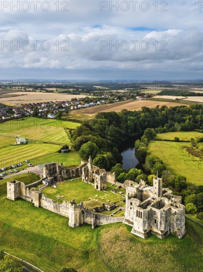 Warkworth Castle over River Coquet from a drone, Warkworth, Northumberland, England, United Kingdom
