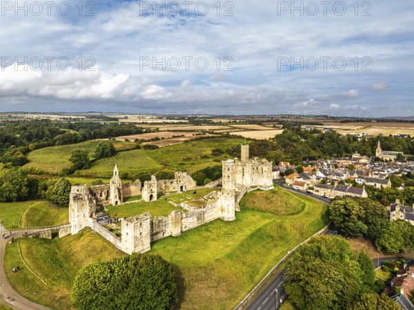 Warkworth Castle over River Coquet from a drone, Warkworth, Northumberland, England, United Kingdom