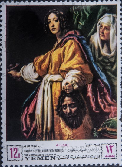 Judith, a Jewish woman with the severed head of Holofernes according to the Book of Judith in the Bible. Portrait in Yemeni postage stamp