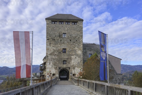 Entrance to Oberkapfenberg Castle with flags, Kapfenberg, Styria, Austria