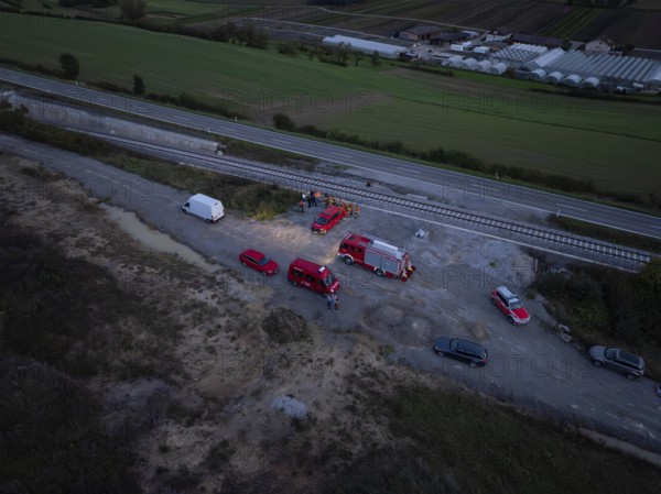 Aerial view of rescue vehicles and personnel near railway tracks and roads, fire drill in the new Hermann Hessebahn railway tunnel, Ostelsheim, Calw district, Germany
