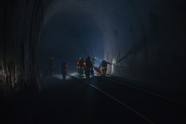 Fire brigade operation in a dark tunnel in dim light, fire brigade exercise in the new construction tunnel of the Hermann Hesse railway, Ostelsheim, Calw district, Germany