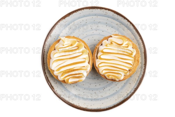 French lemon tart with meringue isolated on white background, top view, flat lay, close up