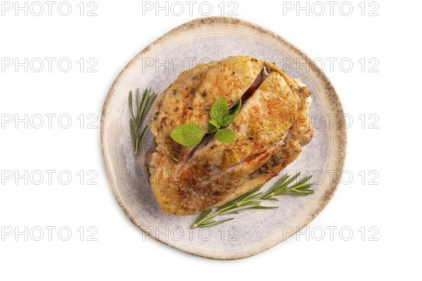 Fried Turkey Thigh with spices and rosemary on plate isolated on white background. top view, flat lay, close up