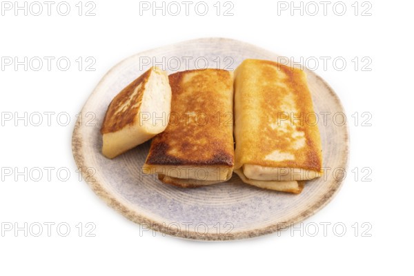Fried crispy pancakes with meat and cheese isolated on white background. top view, flat lay, copy space