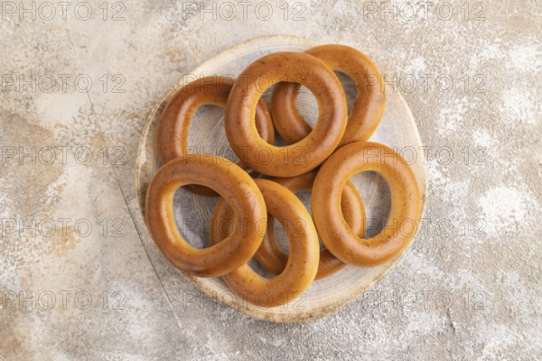 Homemade Ring Bagel on brown concrete background. top view, flat lay, copy space