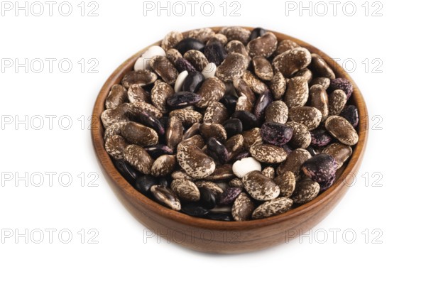Wooden bowl with Kidney beans isolated on white background, side view, close up, minimalism