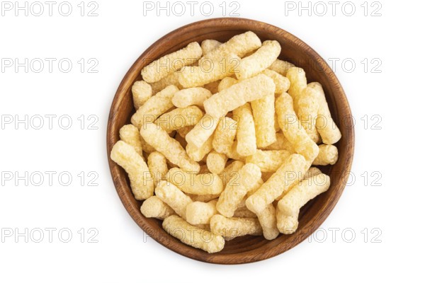 Corn flakes sticks with caramel in wooden bowl isolated on white background. top view, flat lay, close up