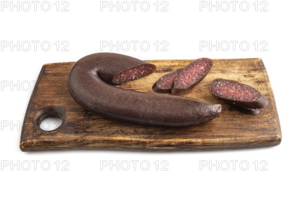 Sujuk sausage isolated on wooden cutting board on white background. Side view, copy space